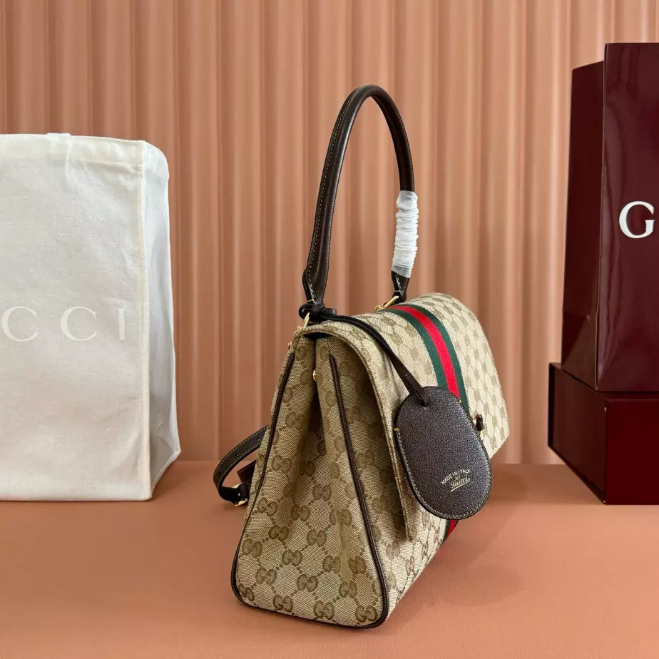 GUCCI PAPARAZZO MEDIUM TOP HANDLE BAG – BG174