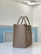 LOUIS VUITTON ONTHEGO MM BICOLOR MONOGRAM EMPREINTE – LW040