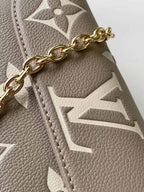 LOUIS VUITTON WALLET ON CHAIN IVY BICOLOR MONOGRAM EMPREINTE LEATHER – LW038